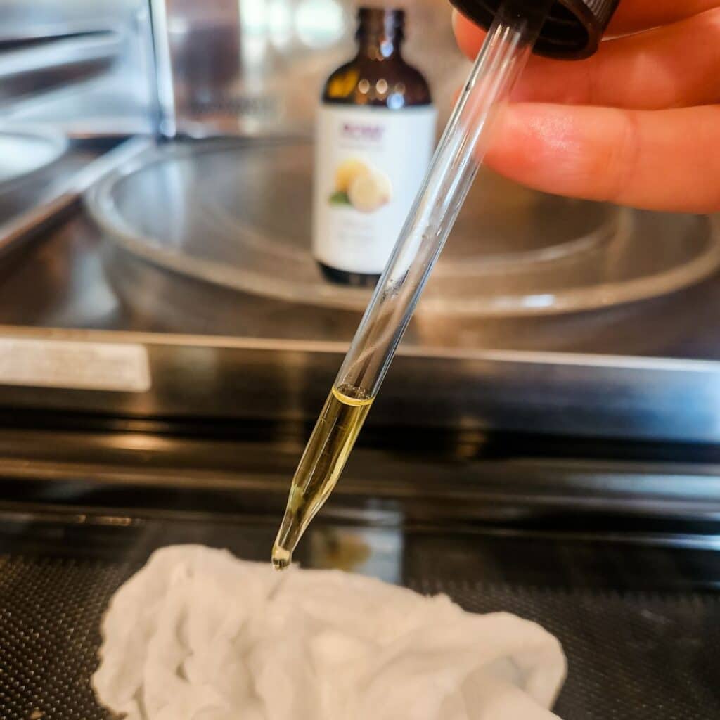 placing drops of lemon essential oil onto the paper towel.