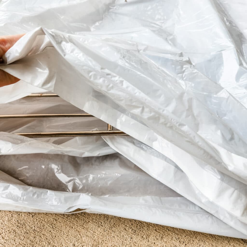 oven racks being cleaned in trash bags